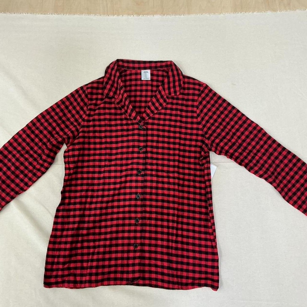 Cozy matching pajama set featuring a classic red and black buffalo check pattern